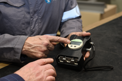 Technician using Almen Gage